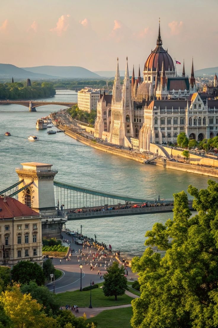 This may contain: an aerial view of the city and its bridge in budapest, with people walking on it