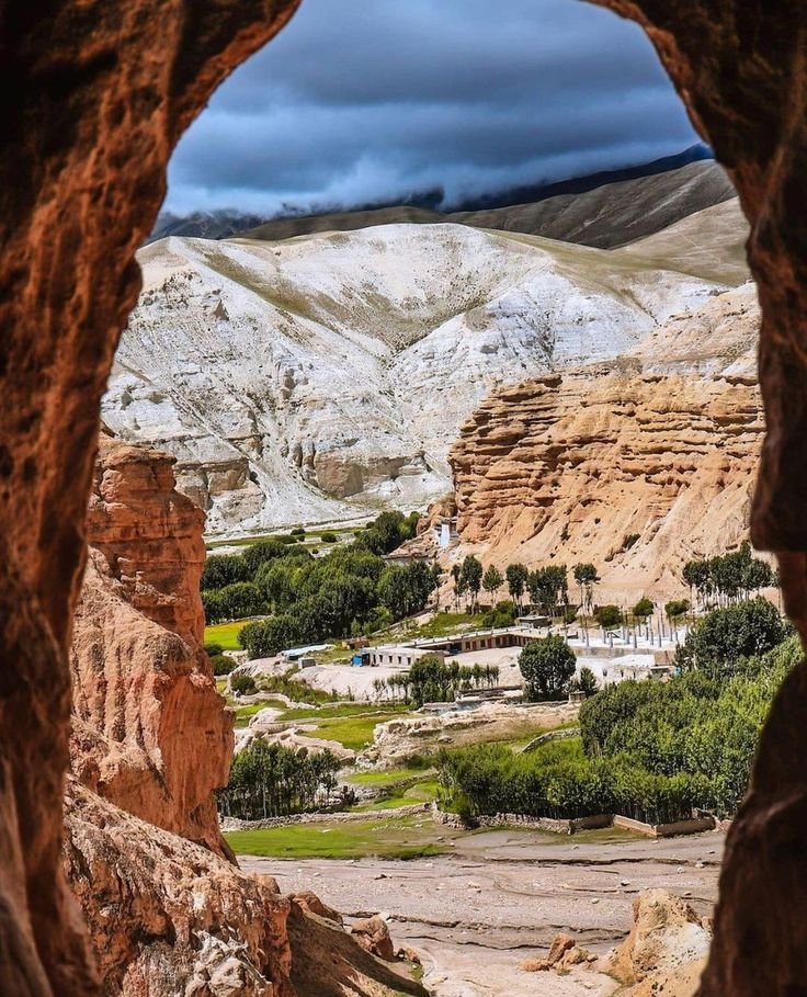 This may contain: an open window in the side of a mountain