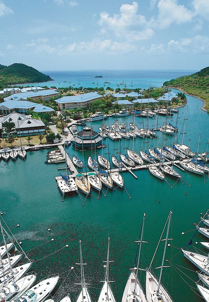 This may contain: an aerial view of boats docked in the water