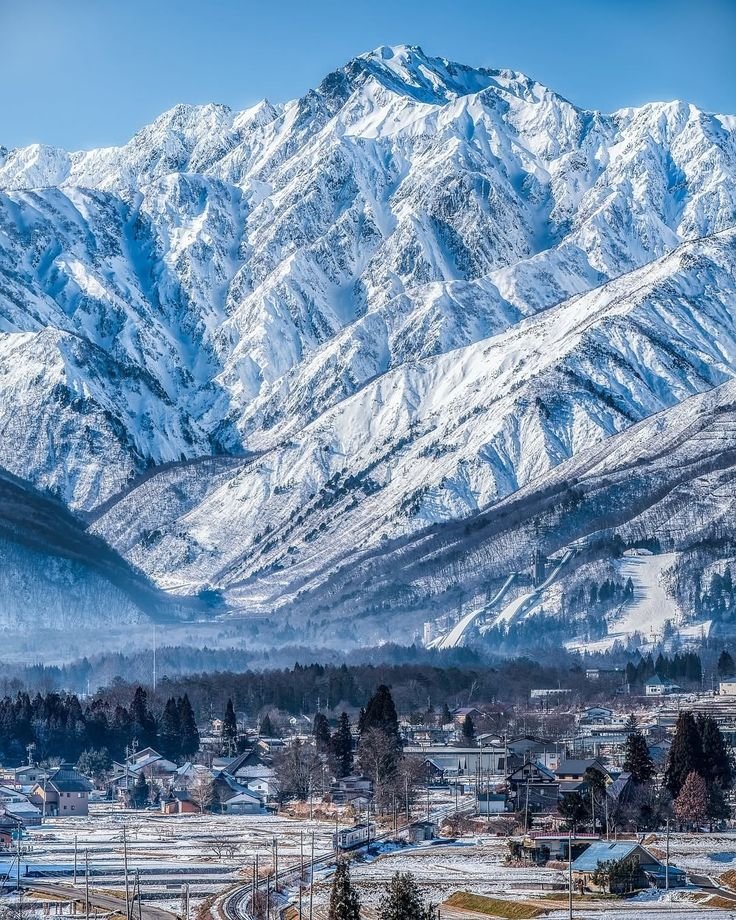 This may contain: the mountains are covered in snow and there is no image on it to provide a caption for