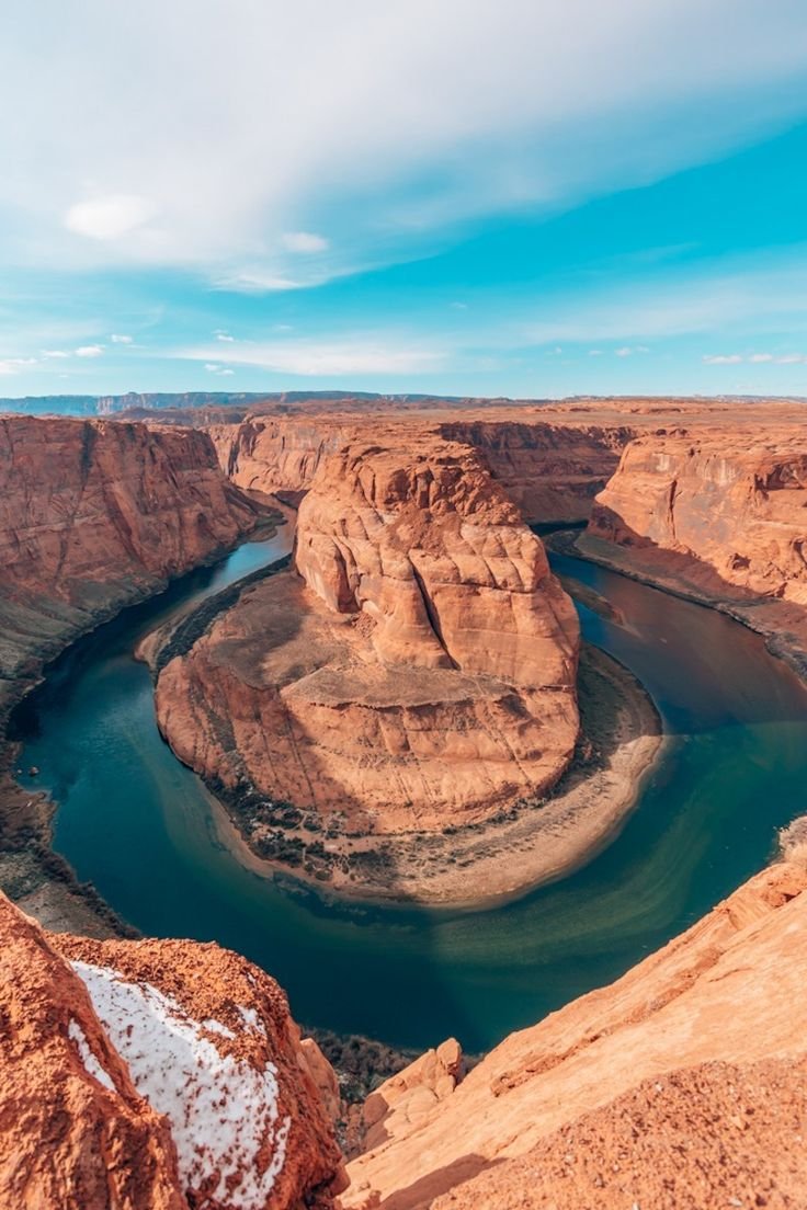 This may contain: a river in the middle of a canyon
