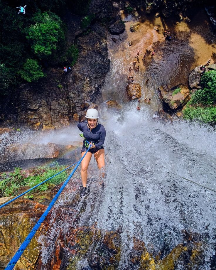 This may contain: a person on water skis going over a waterfall