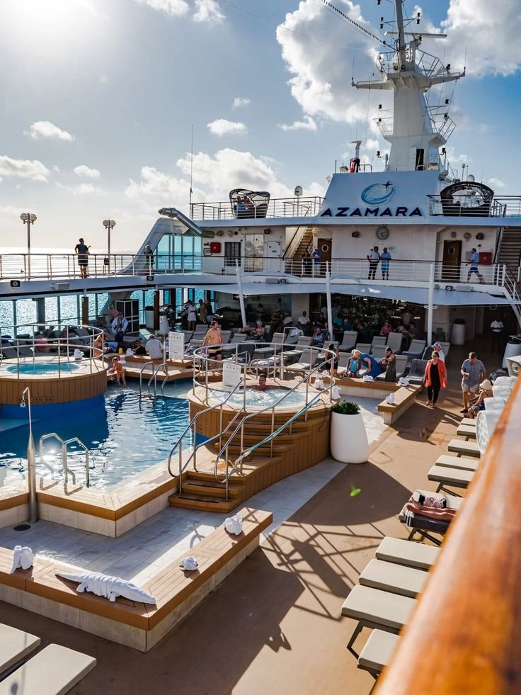 This may contain: people are relaxing on the deck of a large ship