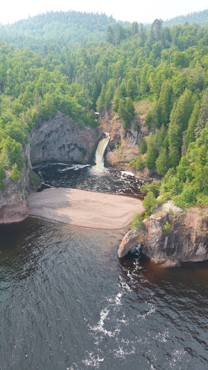 This may contain: an aerial view of the water and trees