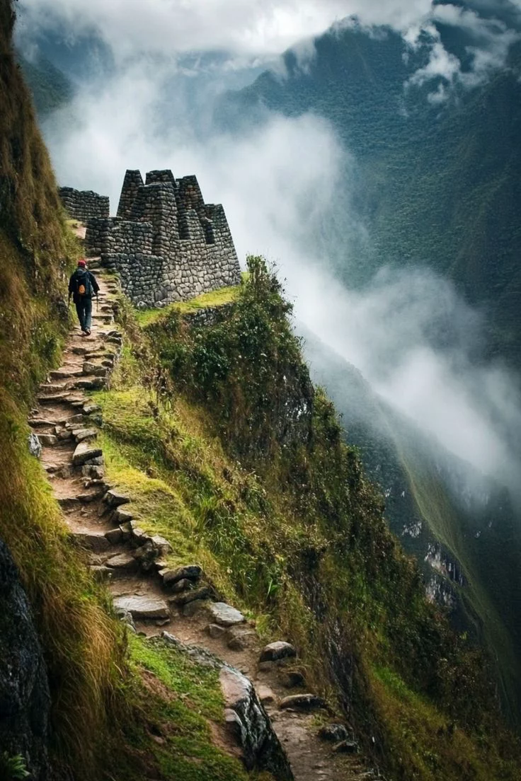 This may contain: a man walking up the side of a mountain