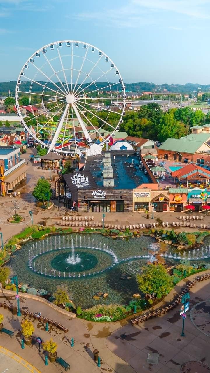 This may contain: an aerial view of the amusement park and ferris wheel