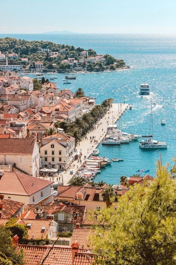 This may contain: an aerial view of a city with boats in the water