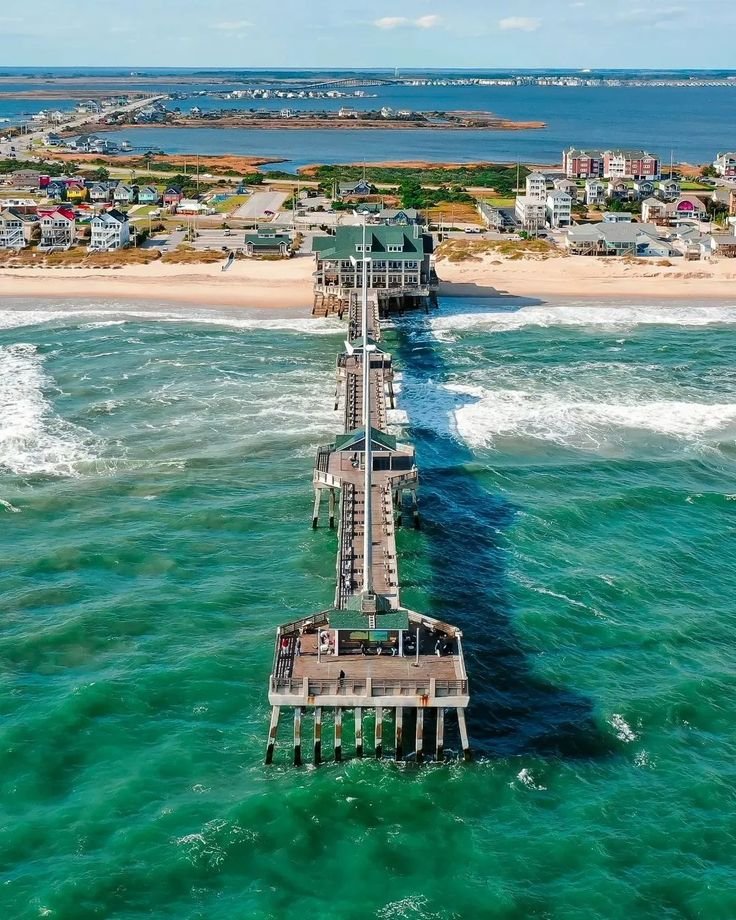 This may contain: an aerial view of a pier in the ocean