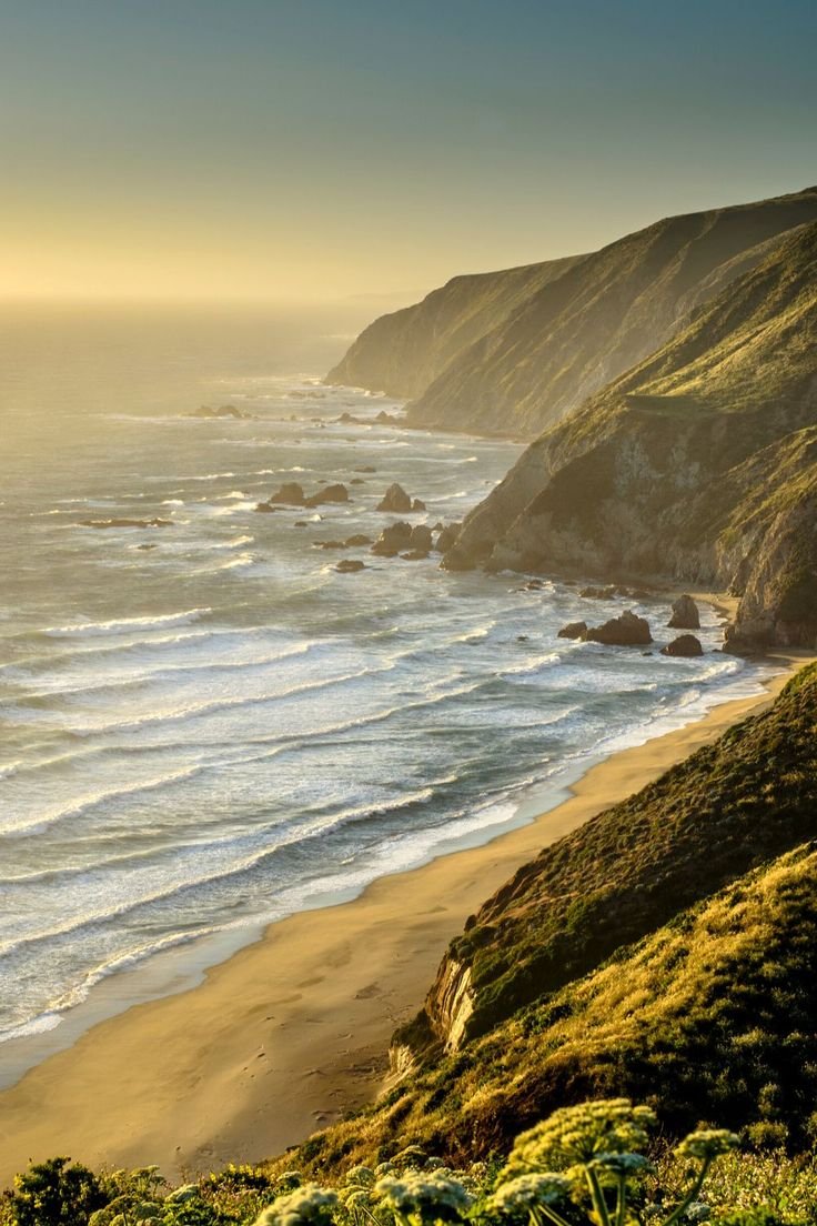 This may contain: an ocean view from the top of a hill