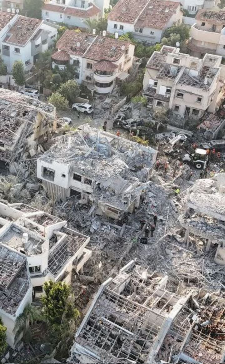 This may contain: an aerial view of destroyed buildings in the city