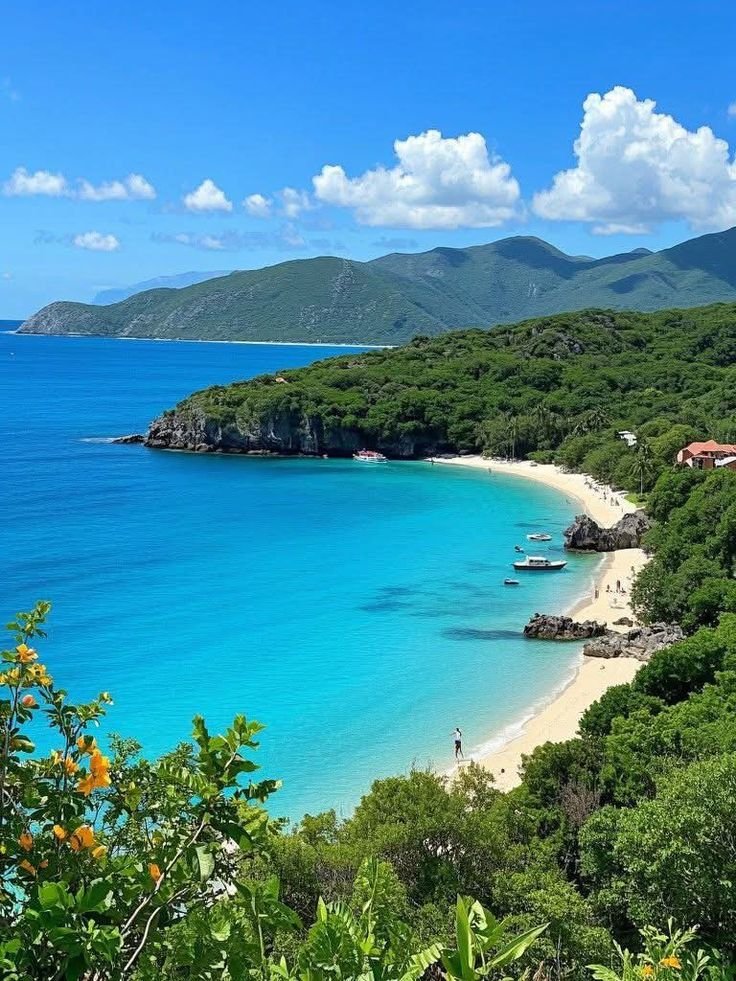 This may contain: the beach is surrounded by lush green trees and clear blue water with boats on it