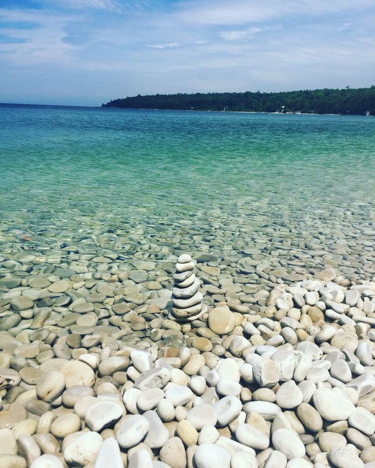 This may contain: the rocks are stacked on top of each other