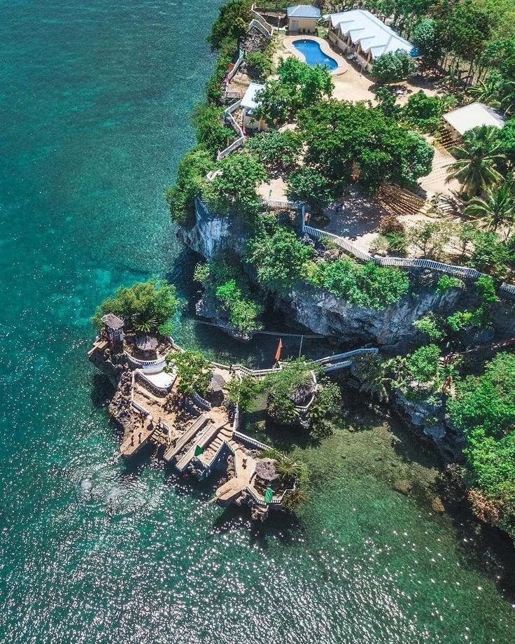 This may contain: an aerial view of a house on the water