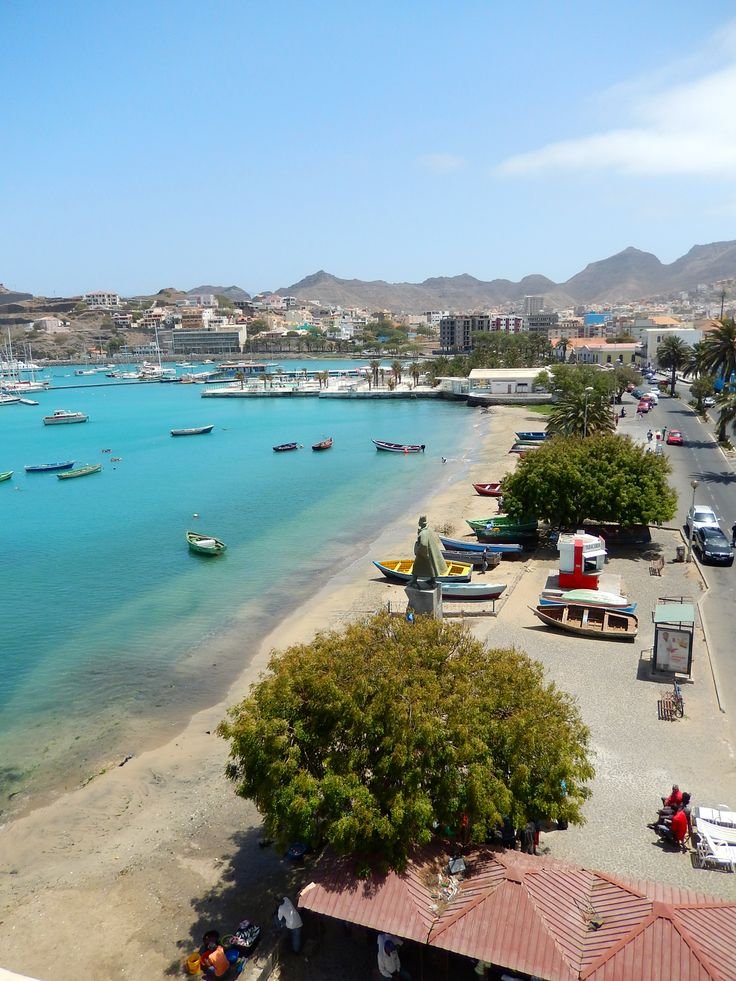 This may contain: the beach is full of boats and people