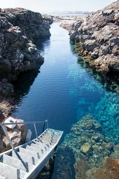 This may contain: the water is crystal clear and blue