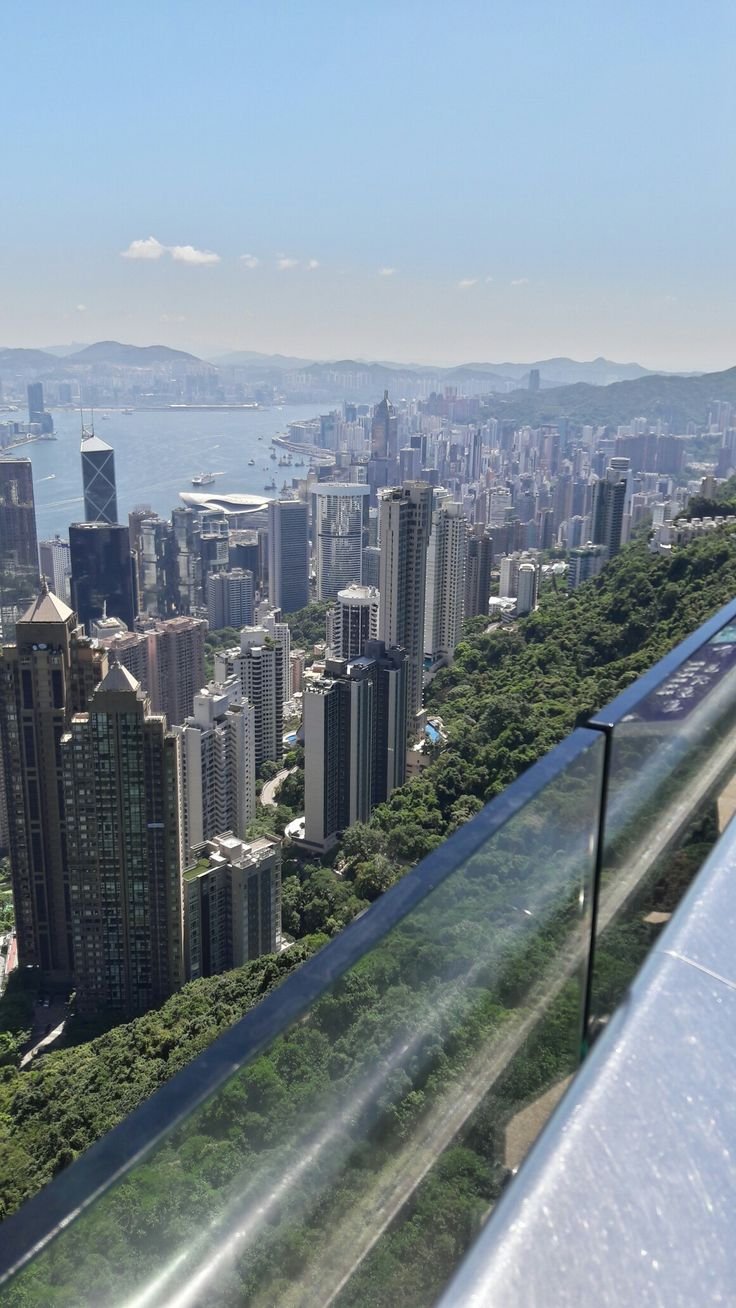 This may contain: a view of a city from the top of a building