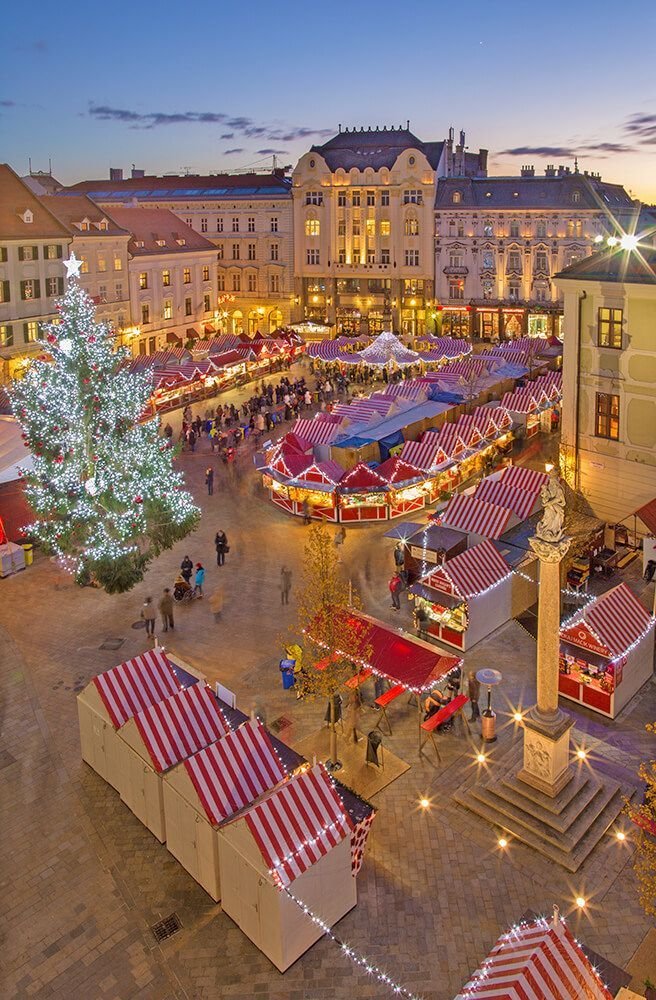 This may contain: an aerial view of a christmas market in the city