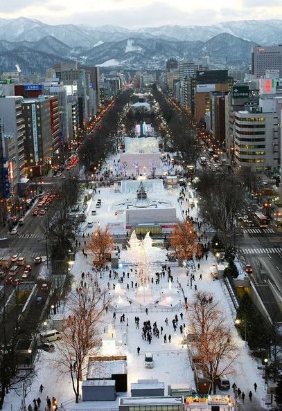 This may contain: an aerial view of a city in the winter