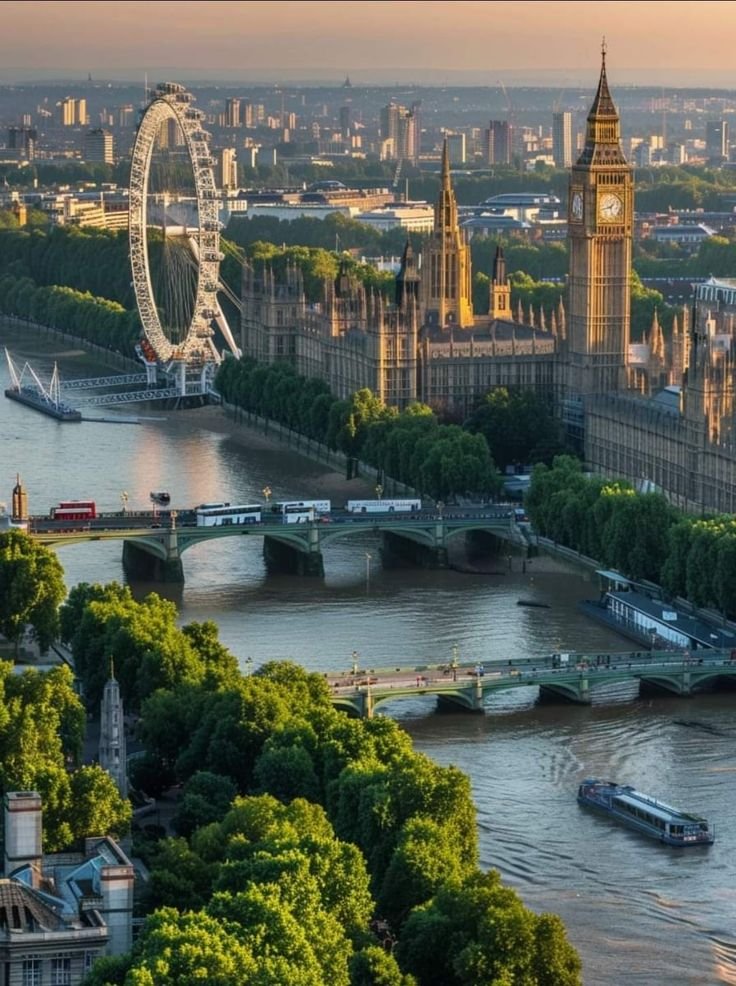 This may contain: the big ben clock tower towering over the city of london and river thames in england