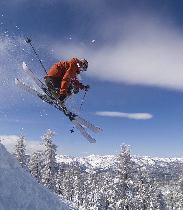 This may contain: a man flying through the air while riding skis