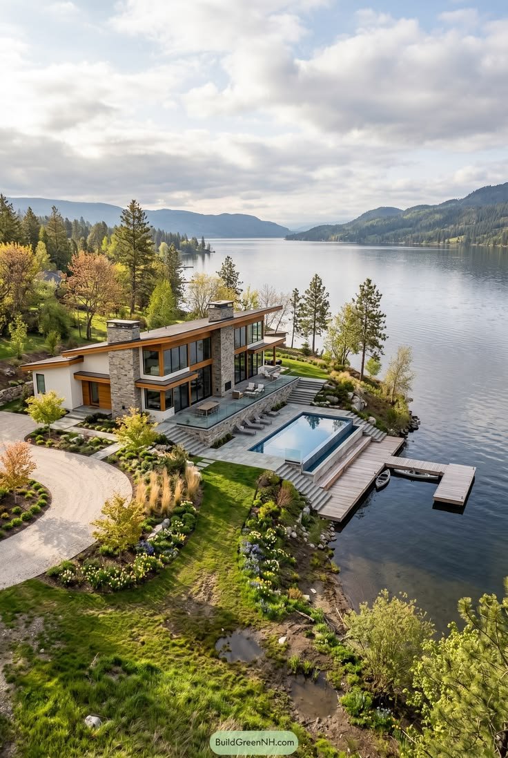 This may contain: an aerial view of a house on the water