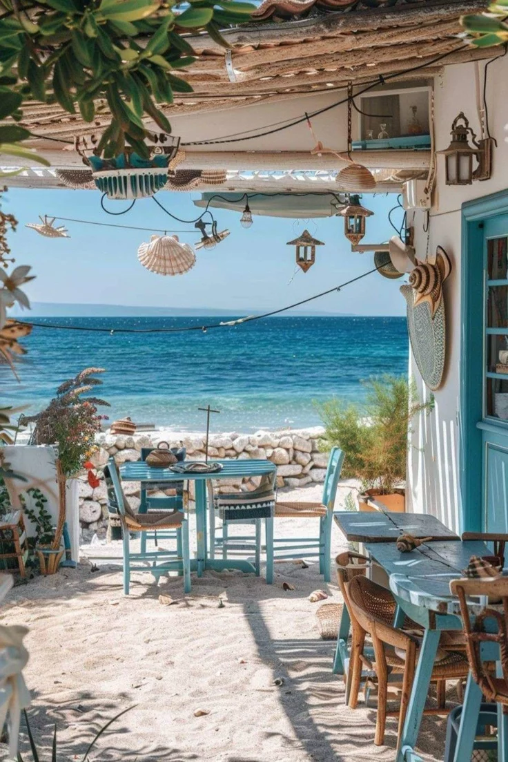 This may contain: an outdoor dining area overlooking the ocean