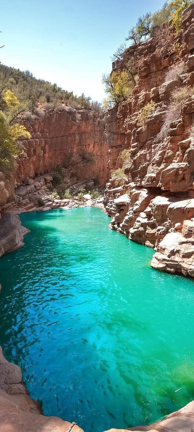 This may contain: the water is blue and green in the canyons that surround it's pools