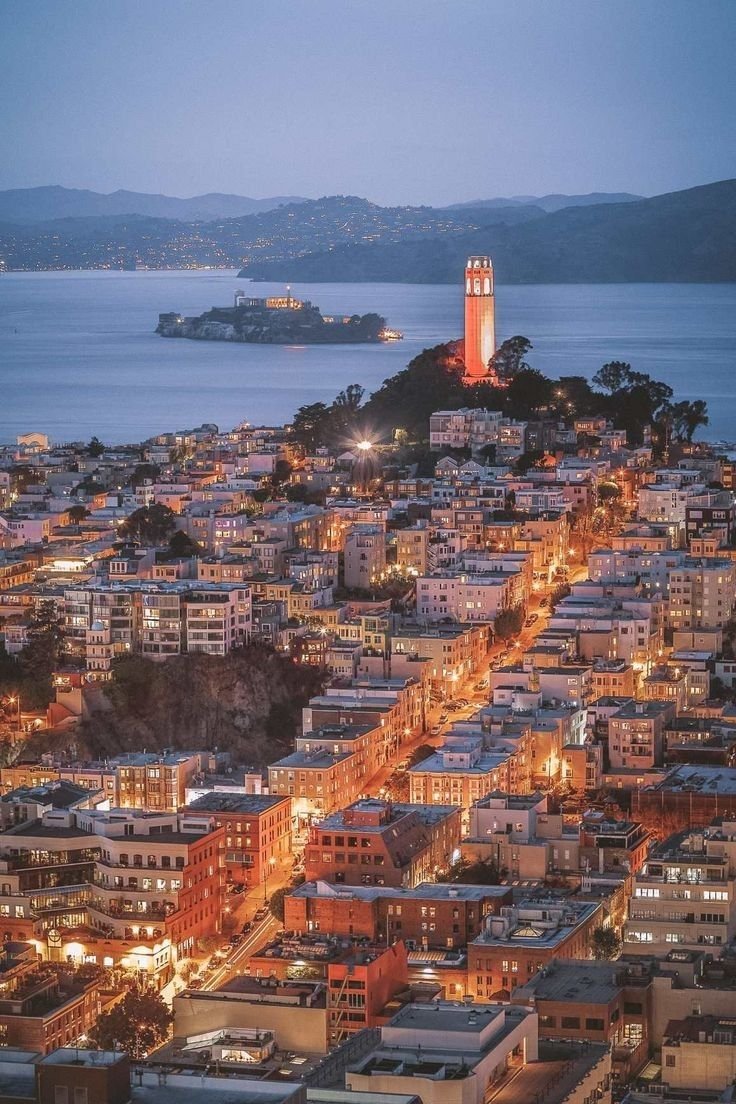 This may contain: an aerial view of a city at night